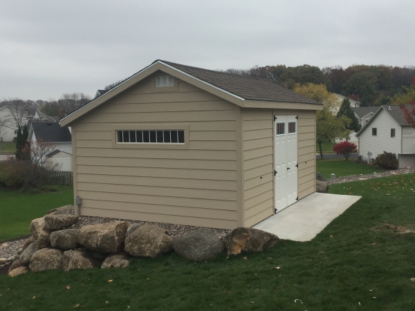 Quaker shed at edge of retaining wall
